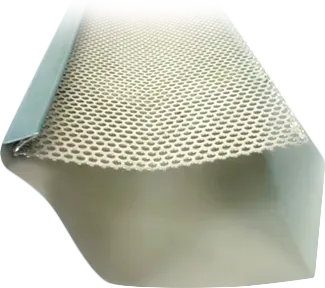 Leaf guard mesh fitted over a spouting profile